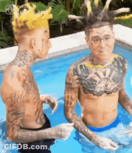 Two Men With Tattoos Sitting In Pool GIF