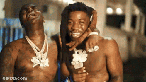 Two Men Without Shirts Are Standing Next To Each Other And Smiling . GIF