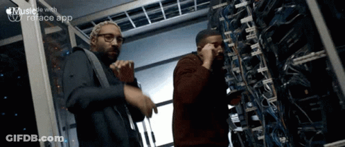 Two Men Working In Server Room GIF