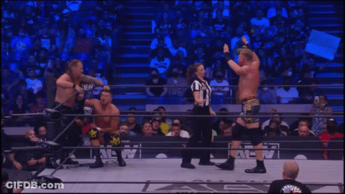 Two Men Wrestling In A Ring GIF