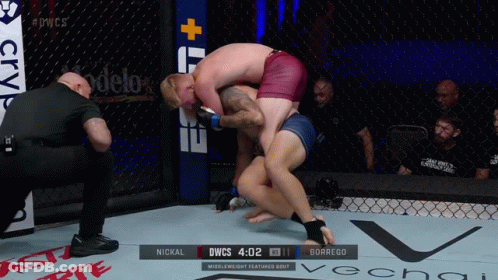 Two Men Wrestling In Cage Scoreboard DWCS GIF