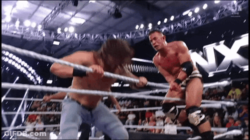 Two Men Wrestling In NX Ring GIF