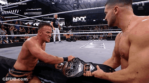 Two Men Wrestling In NXT Ring GIF
