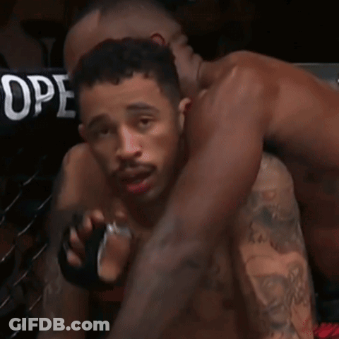 Two Men Wrestling In Ring GIF