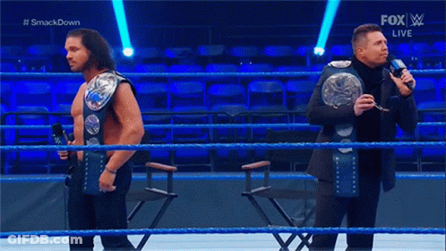 Two Men Wrestling In Ring GIF
