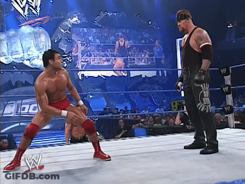 Two Men Wrestling In Ring GIF