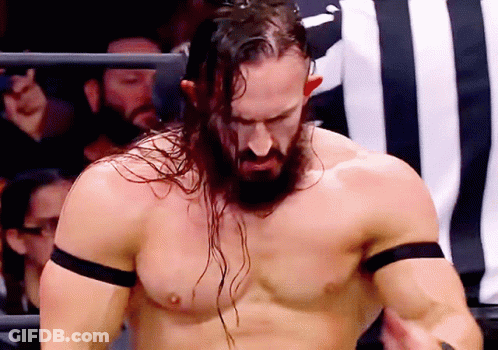 Two Men Wrestling In Ring Behind Chain Link Fence GIF