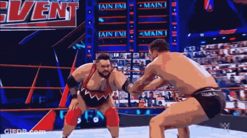 Two Men Wrestling In Ring GIF