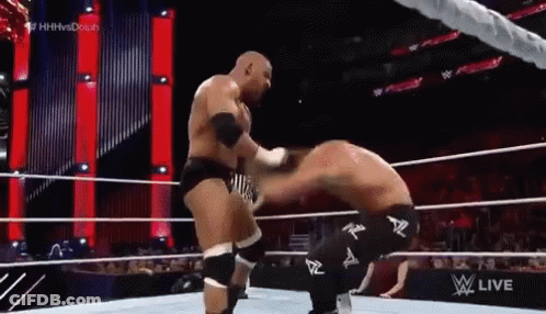 Two Men Wrestling In Ring One Kneeling GIF