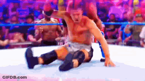 Two Men Wrestling In Ring One On Floor GIF