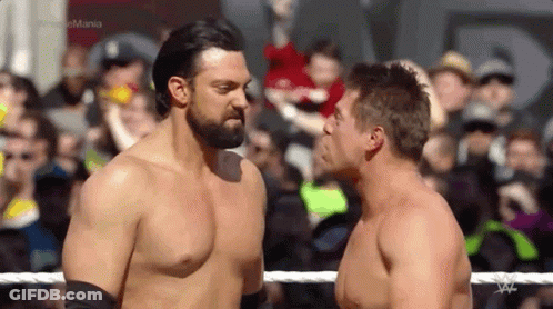 Two Men Wrestling In Ring GIF