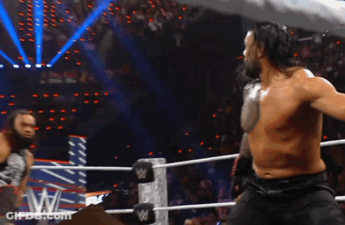 Two Men Wrestling In Ring GIF