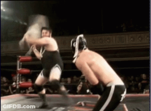 Two Men Wrestling In Ring Saying A GIF