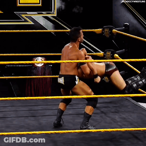 Two Men Wrestling In Ring Saying NX GIF