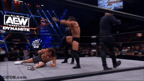 Two Men Wrestling In Ring With AEW Logo GIF