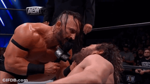 Two Men Wrestling In Ring With AEW Microphone GIF