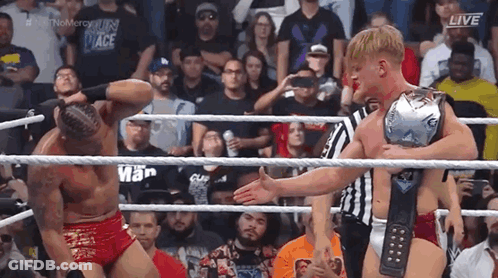 Two Men Wrestling In Ring With Championship Belt GIF