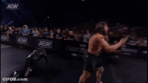Two Men Wrestling In Ring With Crowd GIF