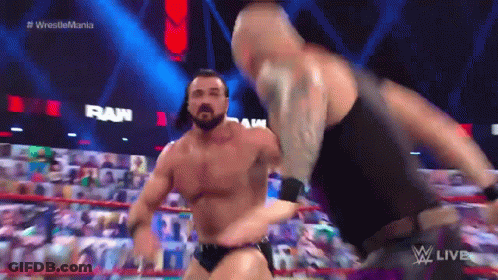 Two Men Wrestling In Ring With Crowd GIF