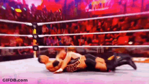 Two Men Wrestling In Ring With Crowd GIF