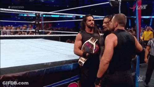 Two Men Wrestling In Ring With Crowd GIF