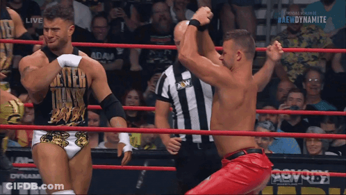 Two Men Wrestling In Ring With Dynamite GIF