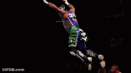 Two Men Wrestling In Ring With Dynamite Banner GIF