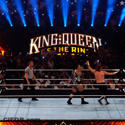 Two Men Wrestling In Ring With King Queen Logo GIF