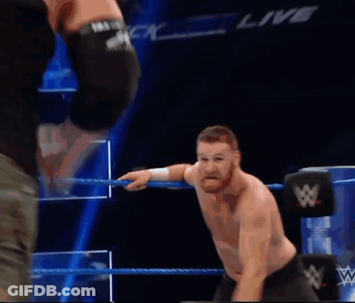 Two Men Wrestling In Ring With Live GIF