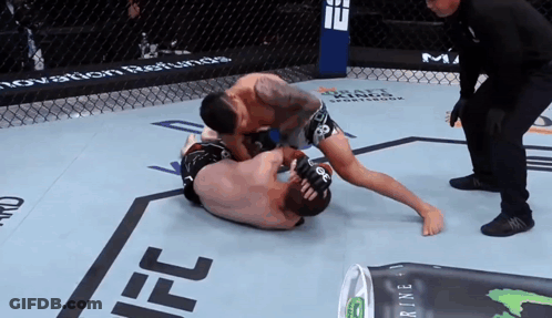 Two Men Wrestling In Ring With Monster Energy Drink GIF