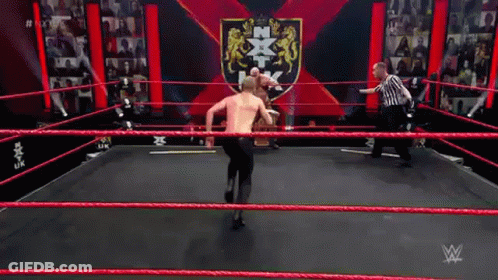 Two Men Wrestling In Ring With Referee GIF
