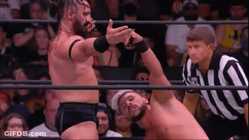 Two Men Wrestling In Ring With Referee GIF