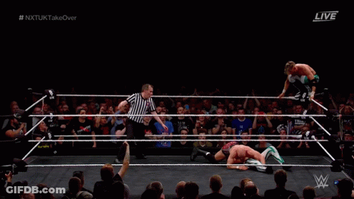 Two Men Wrestling In Ring With Referee GIF