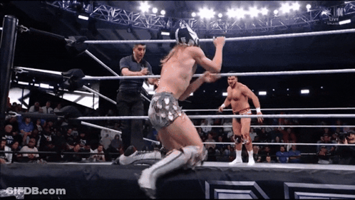 Two Men Wrestling In Ring With Referee GIF