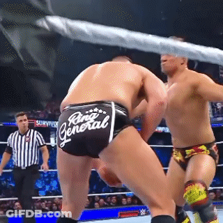 Two Men Wrestling In Ring With Rina General Shorts GIF