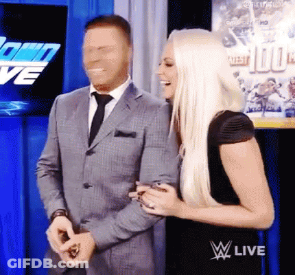 Two Men Wrestling In Ring With Rina General Shorts GIF