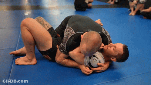 Two Men Wrestling On Blue Mat GIF