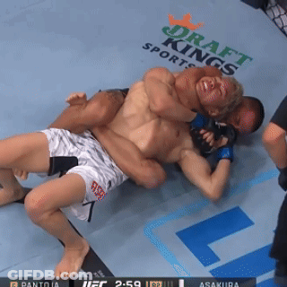 Two Men Wrestling On Draft Kings Sports Mat GIF