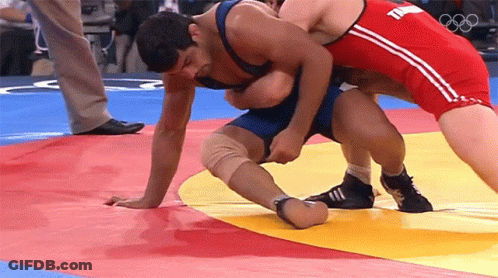 Two Men Wrestling On Mat, One With T Shirt GIF