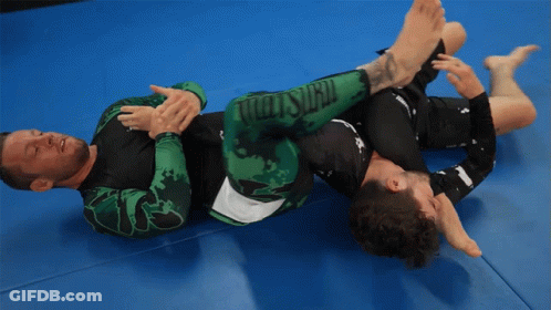 Two Men Wrestling On Mat GIF