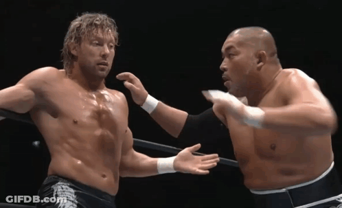 Two Men Wrestling, One In Dragon Shorts GIF