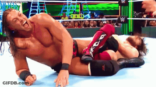 Two Men Wrestling, One In Red Knee Pads GIF