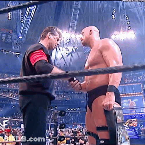 Two Men Wrestling Ring One Holding Belt GIF