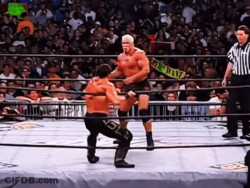 Two Men Wrestling Top Heavy Sign GIF