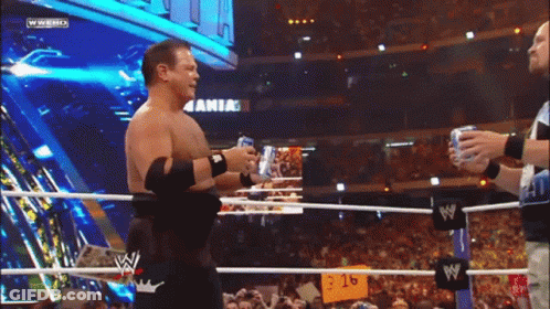 Two Men Wrestling With Arik Sign GIF