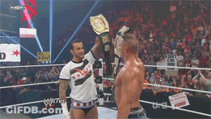 Two Men Wrestling With I Can't Come Back Sign GIF