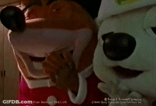 Two Mickey Mouse Mascots Standing Next To Each Other GIF