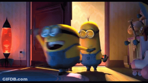Two Minions Are Hugging Each Other In A Room With A Lamp In The Background GIF