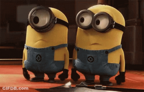 Two Minions In Goggles And Overalls On Red Carpet GIF