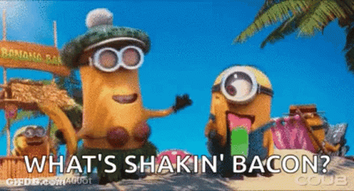 Two Minions On Beach Saying What's Shakin Bacon GIF